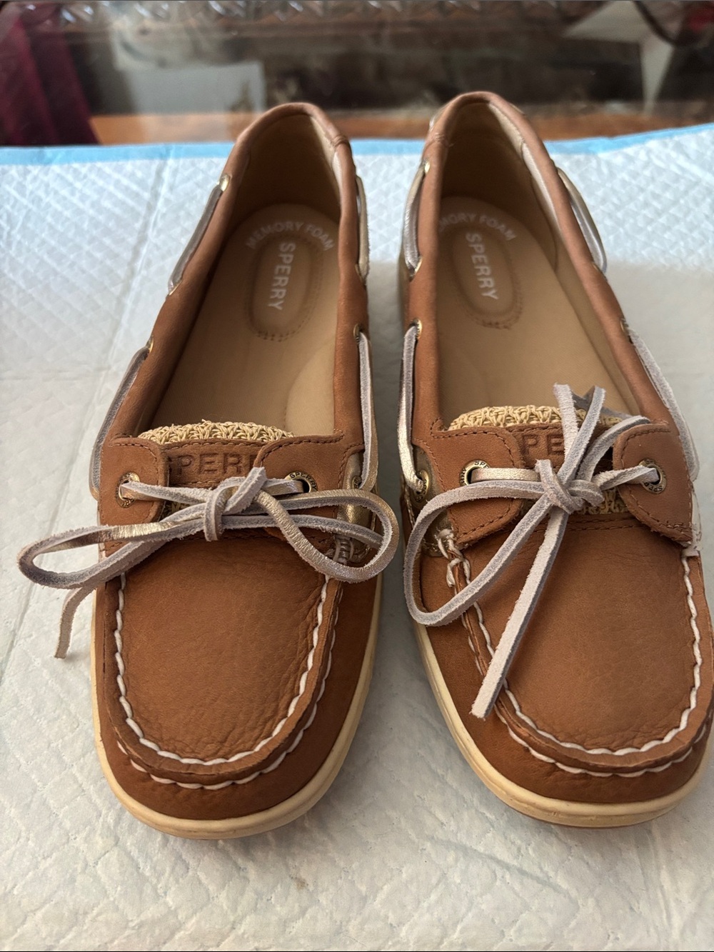 Sperry Women's Chestnut Brown Leather Moccasin Boat Shoes with silver Laces.